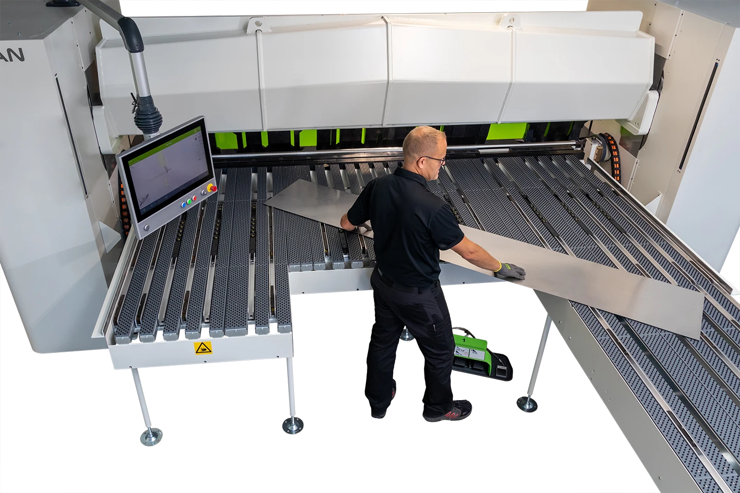 operator handling large sheet metal on the backgauge to a cidan folding machine on white background