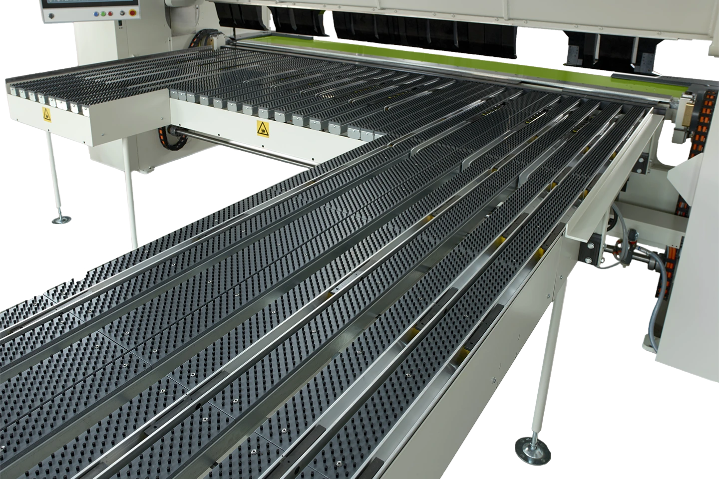 anslagsbord med borstar till en kantvikmaskin mot vit bakgrund